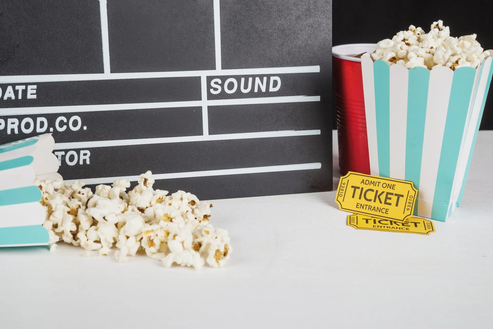 popcorn-tickets-near-clapperboard